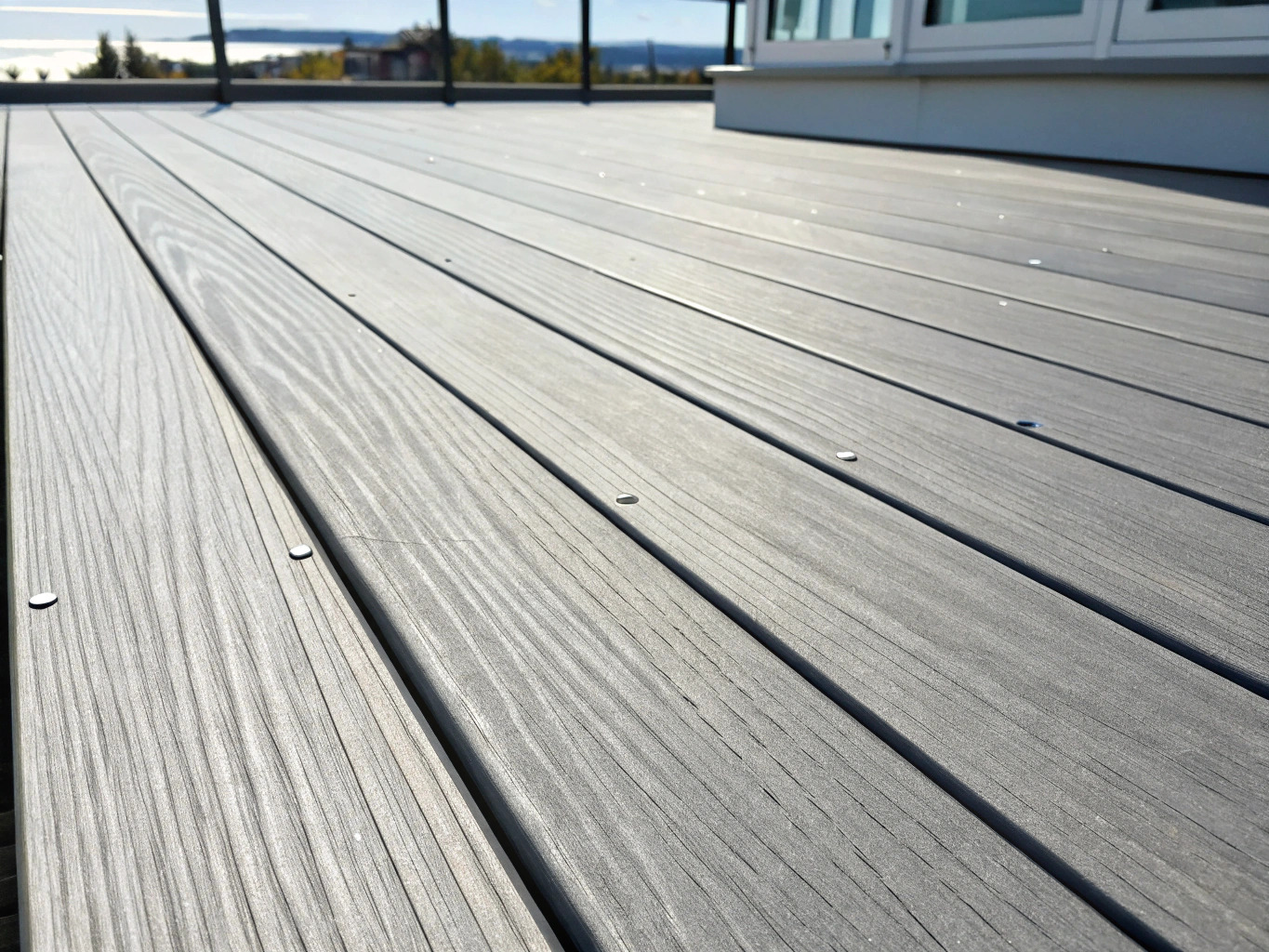 Close-up of grey composite decking boards on a coastal deck