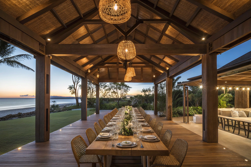 Luxury resort-style outdoor pavilion Sunshine Coast set up for evening entertaining with dining table